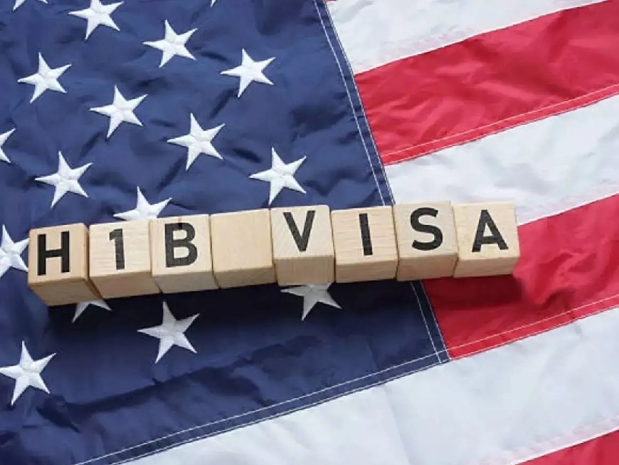 H-1B visa blocks placed on an American flag representing proposed US visa restrictions