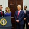 Donald Trump standing beside Michael Dell during a White House event amid scrutiny over Dell’s Pentagon contract award.
