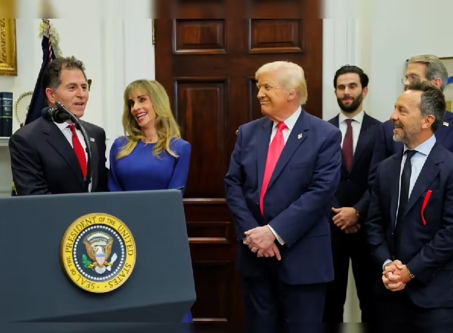 Donald Trump standing beside Michael Dell during a White House event amid scrutiny over Dell’s Pentagon contract award.