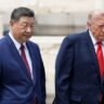 Donald Trump and Xi Jinping walk together during the US-China summit in Beijing.