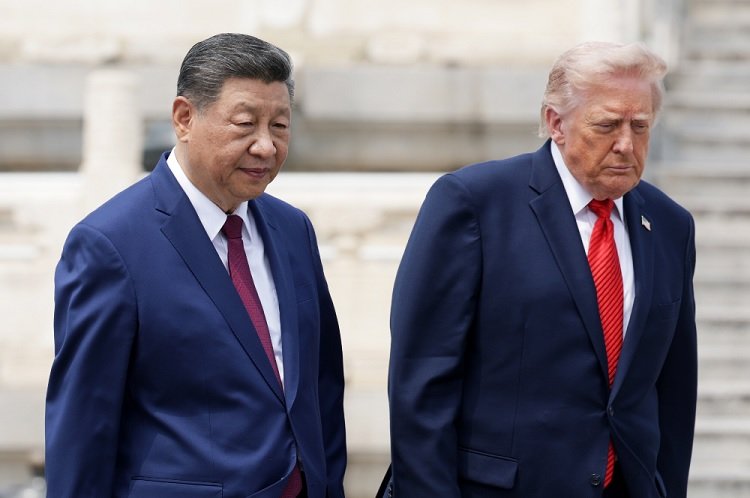 Donald Trump and Xi Jinping walk together during the US-China summit in Beijing.