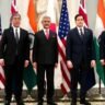 Quad leaders pose during a diplomatic meeting focused on Indo-Pacific cooperation and regional security.