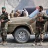 Pakistani security personnel stand beside a vehicle during a security operation following cross-border action along the Pakistan-Afghanistan border on June 29, 2026.