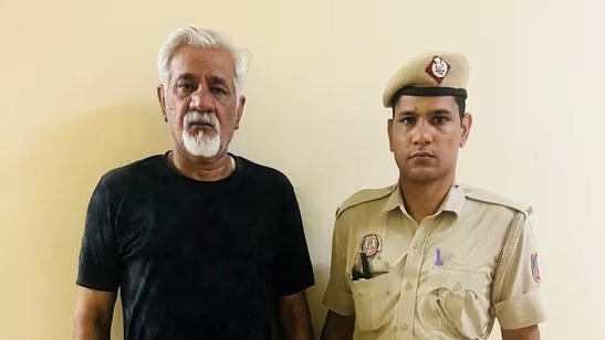 Alt Text Hotel owner Lavkesh Bajaj after his arrest by Delhi Police in connection with the Malviya Nagar fire that killed 21 people.