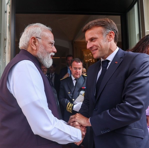 Emmanuel Macron greets Narendra Modi during the Indian Prime Minister's visit to Nice, France.