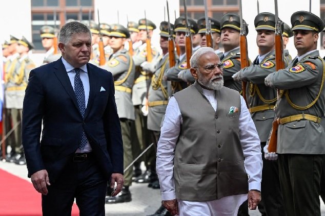 Prime Minister Narendra Modi and Slovak Prime Minister Robert Fico inspect a guard of honour during Modi's visit to Bratislava, Slovakia.