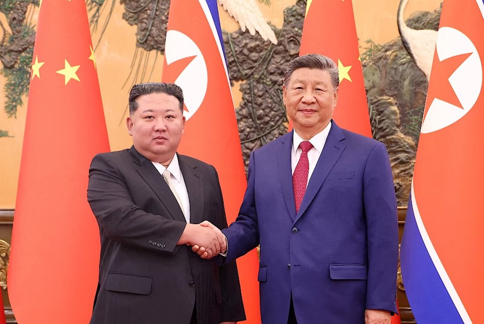 Xi Jinping and Kim Jong Un shake hands during Xi's state visit to North Korea in Pyongyang on June 8, 2026.