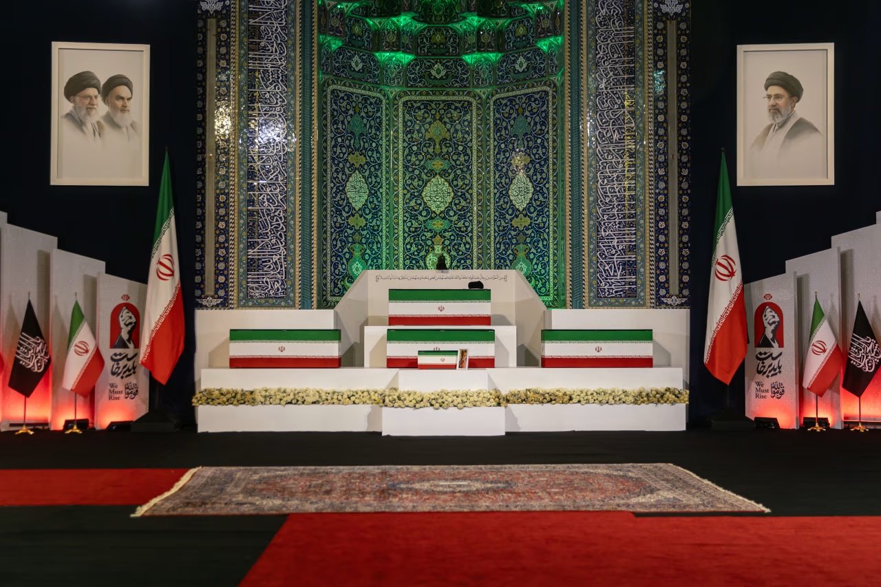 Flag-draped coffins of Ayatollah Ali Khamenei and his 14-month-old granddaughter Zahra Mohammadi Golpayegani displayed during the state funeral in Tehran.