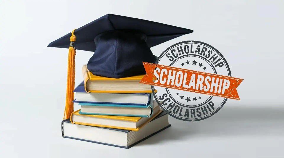 Scholarship in India 2026 books graduation cap and scholarship badge