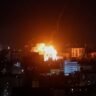 Fire and smoke rise over Kyiv after a Russian ballistic missile strike during an overnight attack that killed two people and injured at least 24 on August 5, 2026.