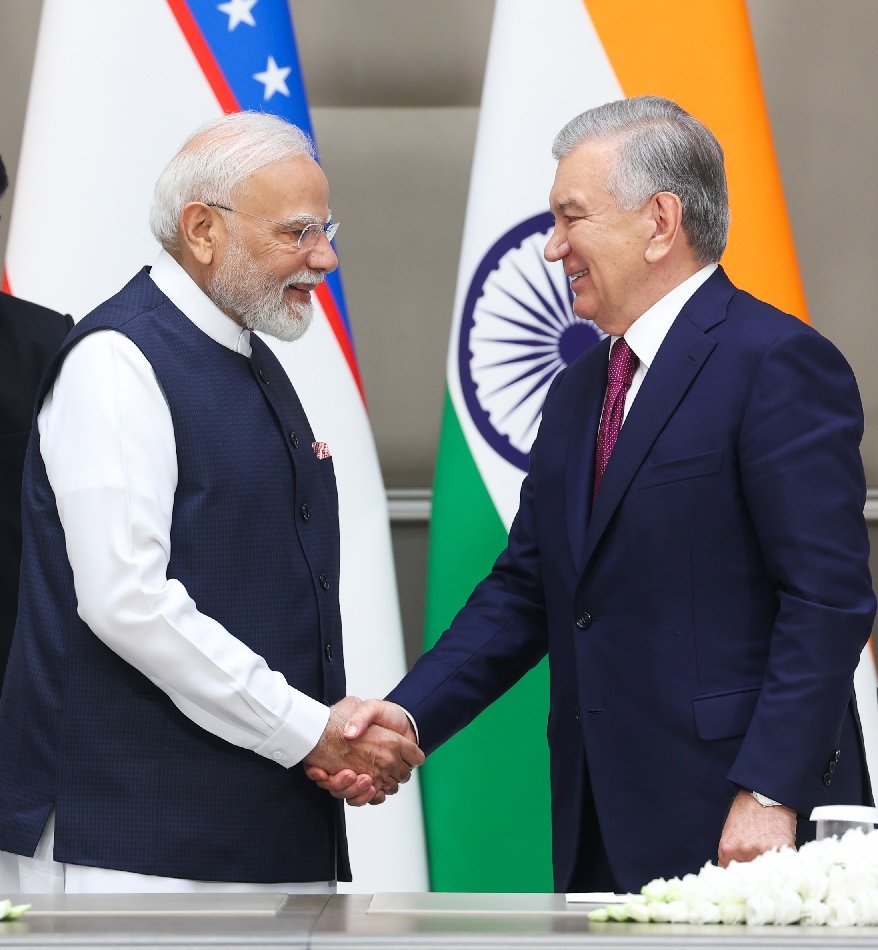 Indian Prime Minister and Uzbekistan President shake hands during bilateral meeting