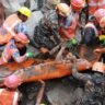 Rescue teams pull a trapped worker from a hydropower tunnel in Nepal