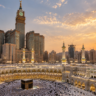 Mecca Grand Mosque with Kaaba and Abraj Al Bait Clock Tower at sunset