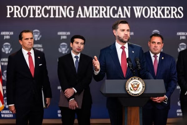 US government officials at a White House press conference announcing action against employment visa fraud
