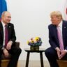 Donald Trump and Vladimir Putin seated together during a meeting