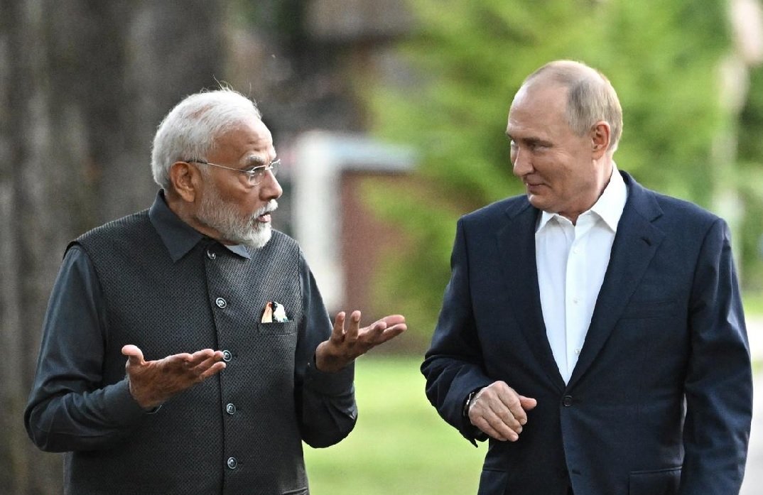 Narendra Modi speaks with Vladimir Putin during India-Russia diplomatic talks
